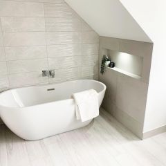Maya White decor wall tiles behind a free standing bath