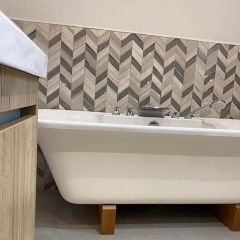 Mystique Latte & Silver Chevron Mosaic wall tiles fitted in a luxury bathroom behind a free standing bath