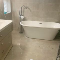 Perla Soft 600x295mm wall and floor tiels fitted in a luxury bathroom with free standing bath