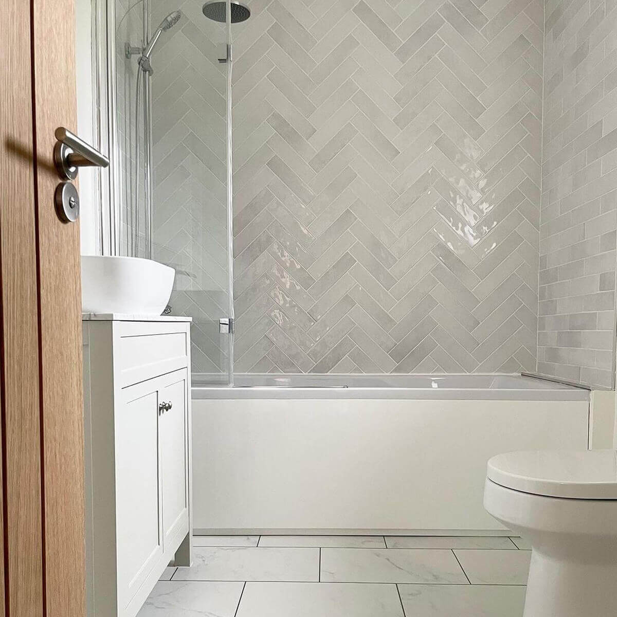 Herringbone bathroom feature wall in paris pearl brick wall tiles