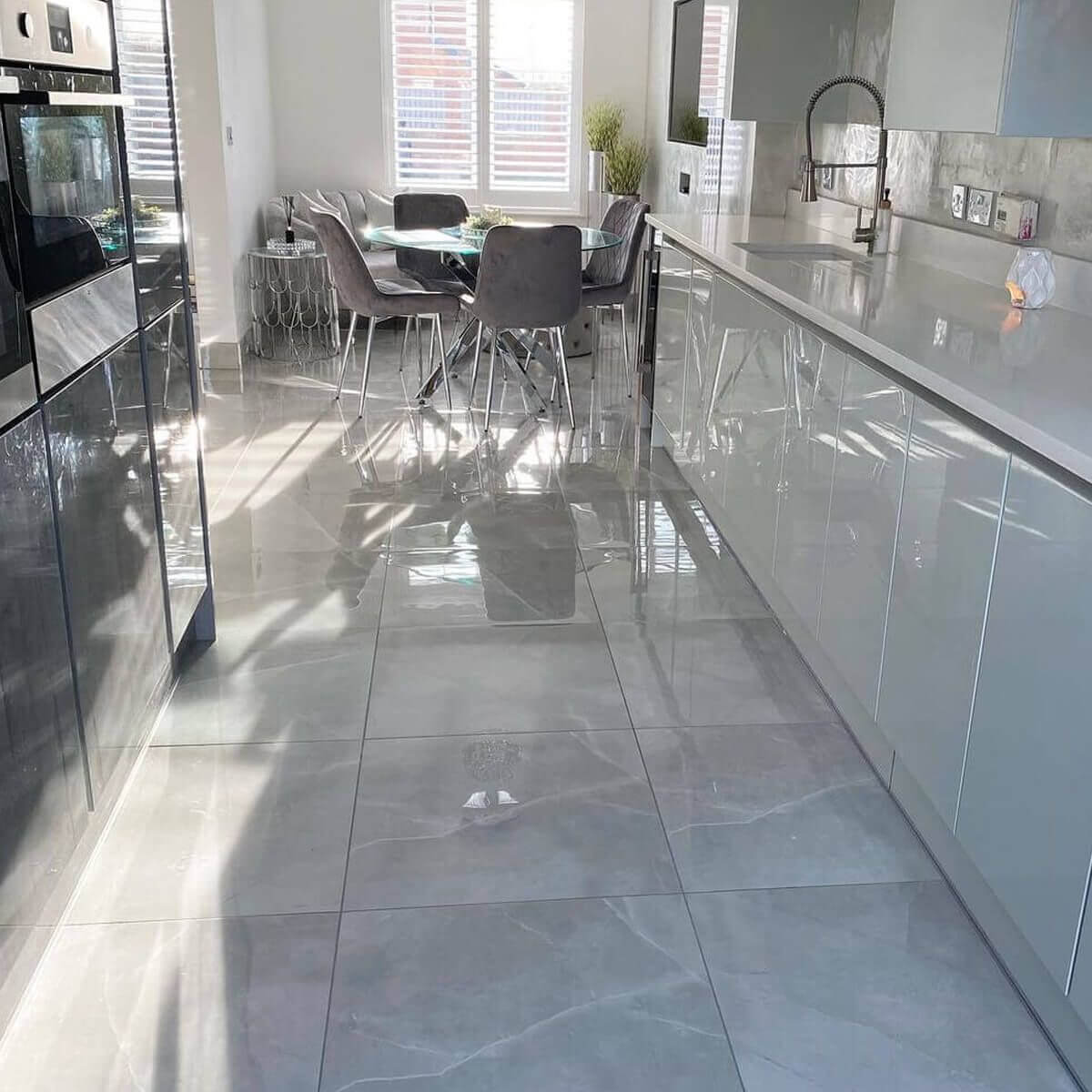 Neutral kitchen design with grey floor tiles