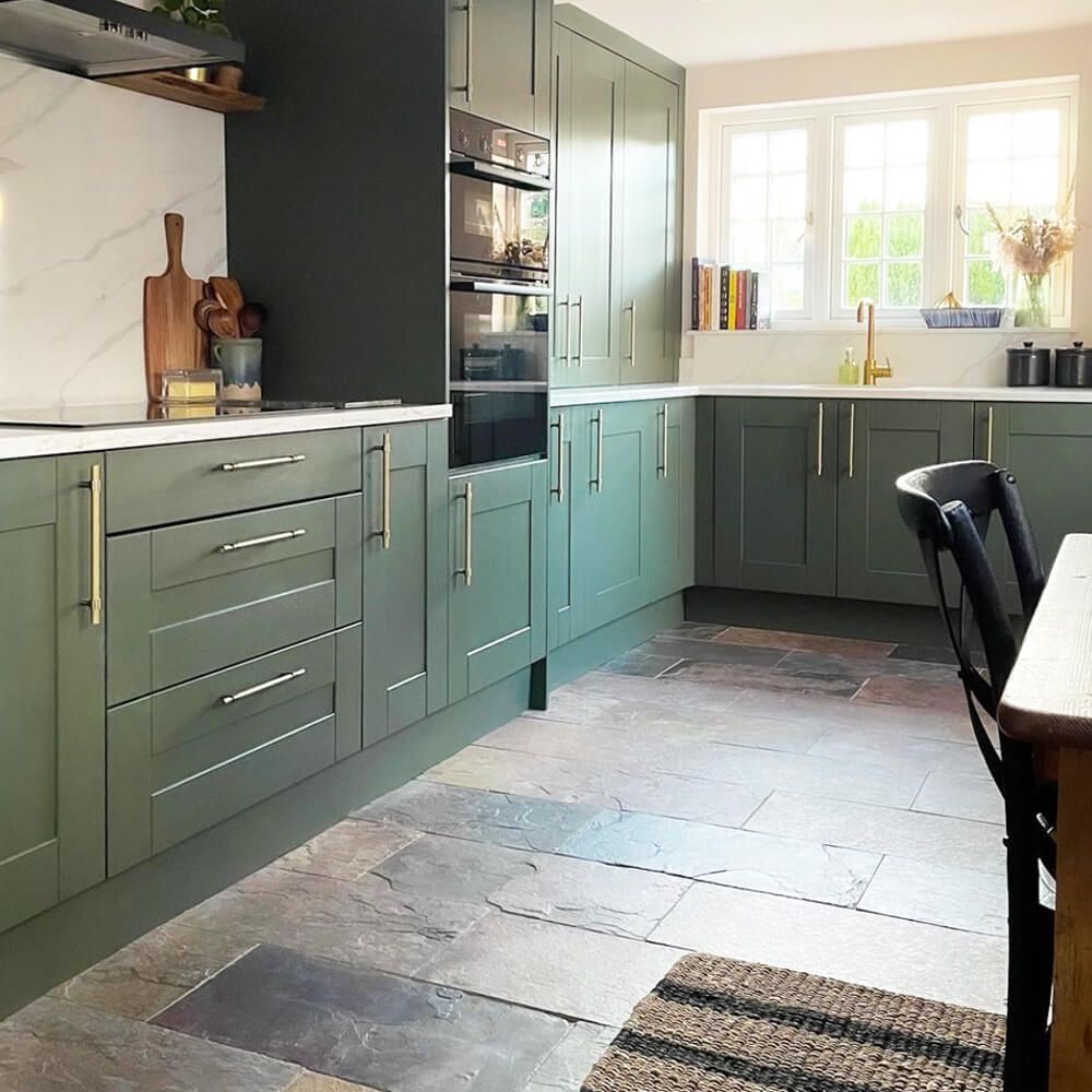 Rustic multicoloured natural slate tiles in a green kitchen