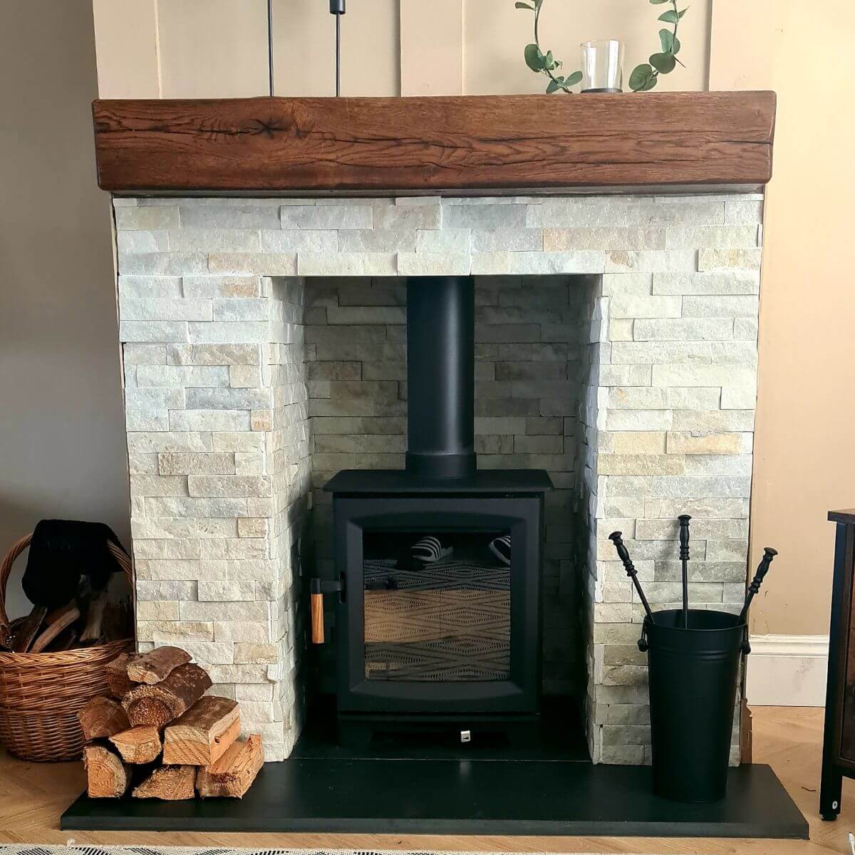 Sparkle cream split face wall cladding in a fireplace surround