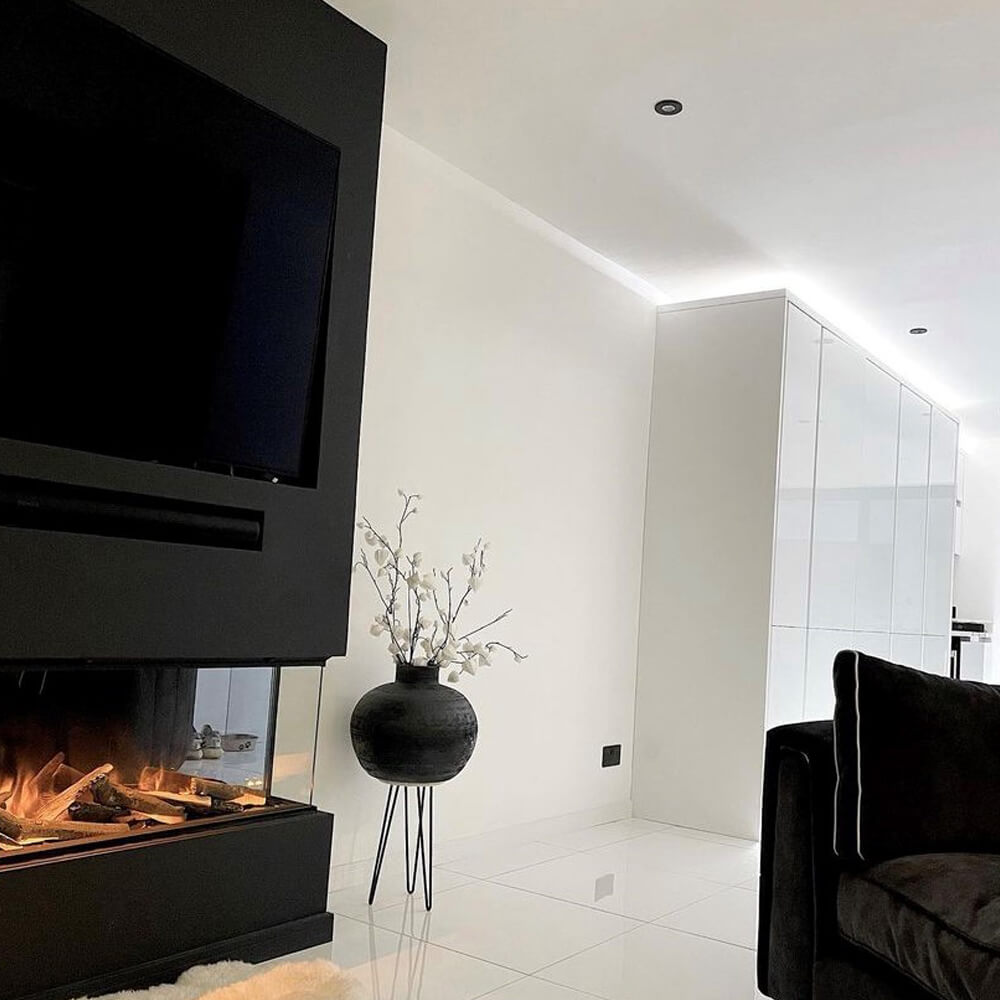 shiny bright white polished porcelain floor tiles in an open plan living area